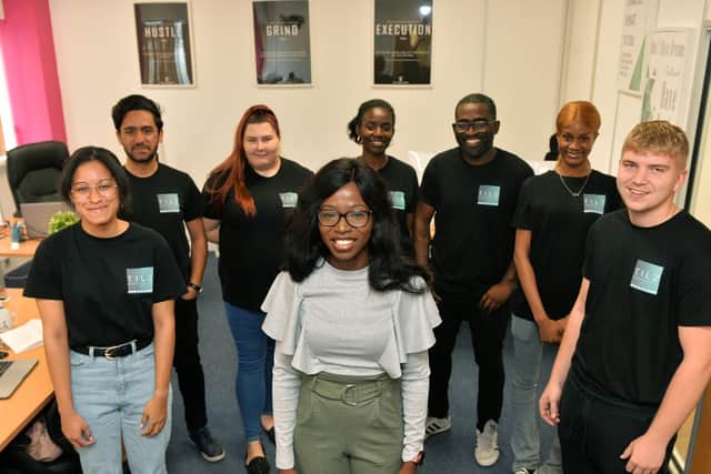 Pictured with her team. Photo: Jonathan Gawthorpe