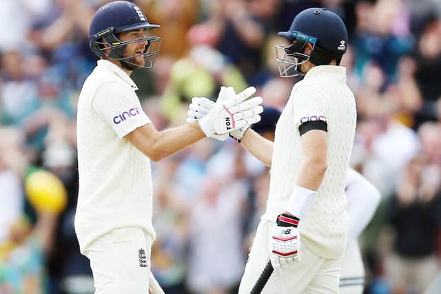 England's Dawid Malan (left) celebrates reaching half a century with team mate Joe Root (right) on day two at Headingley. Picture: Nigel French/PA