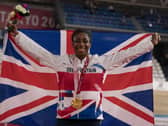 Kadeena Cox celebrates winning Gold in the Women's C4-5 500m Time Trial at Izu Velodrome during day three of the Tokyo 2020 Paralympic Games in Japan