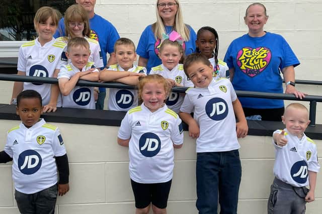 Kidz Club members in their new shirts outside the Holbeck.