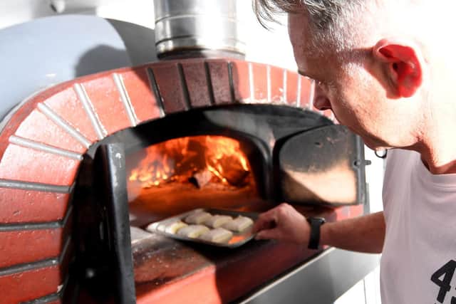 Danny's wood-fired pizzas and dough balls (pictured) are a hit with customers in his hometown and beyond