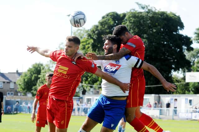 Guiseley's Hamza Bencherif competes for a header. Picture: Steve Riding.