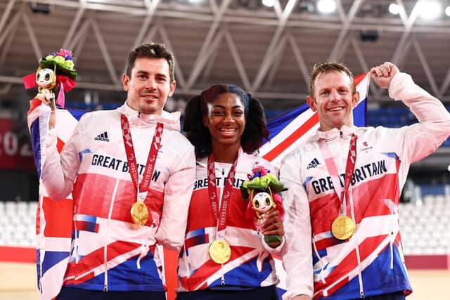 Kadeena Cox, centre, with Jody Cundy, left, and Jaco van Gass after their triumph in the mixed team sprint cycling. Picture: Alex Whitehead/SWpix.com.