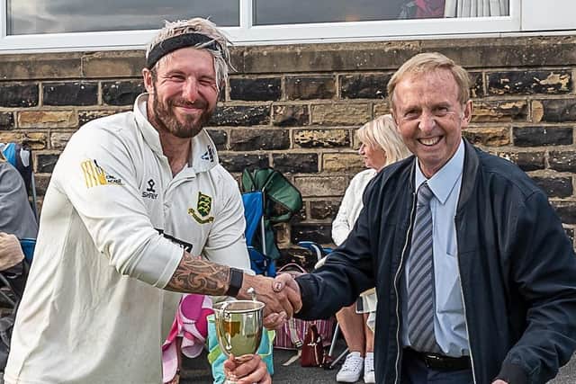 Priestley Cup final man of the match Mark Lawson is presented with his trophy by Peter Rigg, director of Gordon Rigg, the Bradford League sponsors. Picture courtesy: Ray Spencer.