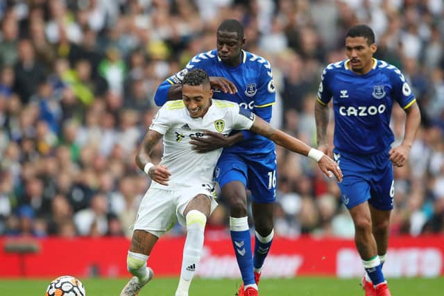 Raphinha battles for the ball against Everton