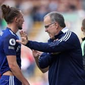 FIRST HALF REGRET: For Leeds United's Luke Ayling, left, pictured in conversation with Whites head coach Marcelo Bielsa in Sunday's 1-1 draw against Burnley at Turf Moor. Picture by Getty.