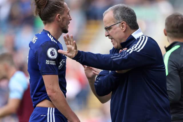FIRST HALF REGRET: For Leeds United's Luke Ayling, left, pictured in conversation with Whites head coach Marcelo Bielsa in Sunday's 1-1 draw against Burnley at Turf Moor. Picture by Getty.