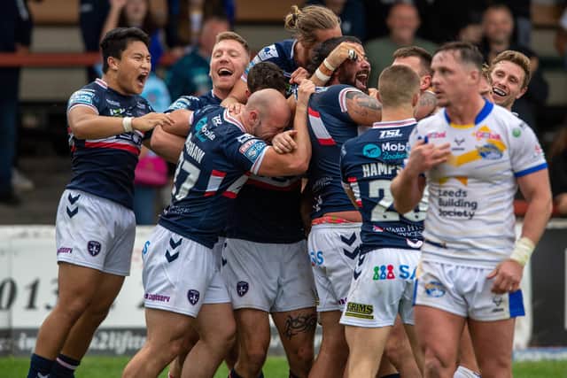 Wakefield Trinity celebrate with Joe Arundel scoring after the match-winning try against Leeds Rhinos Picture: Bruce Rollinson