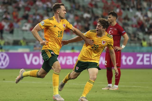 Wales' Aaron Ramsey, left, runs to celebrate with Dan James after scoring his side's first goal in the Euro 2020 clash with Turley in Baku Picture: Naomi Baker/AP