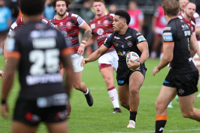 Castleford Tigers' Derrell Olpherts on the attack against Wigan Warriors (John Clifton/SWpix.com)