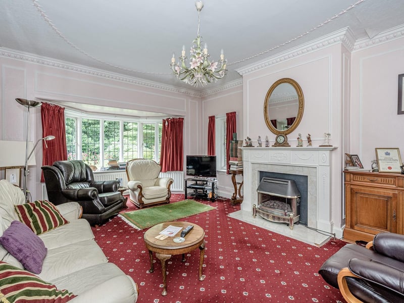 A bay window is a feature of this bright and comfortable room.
