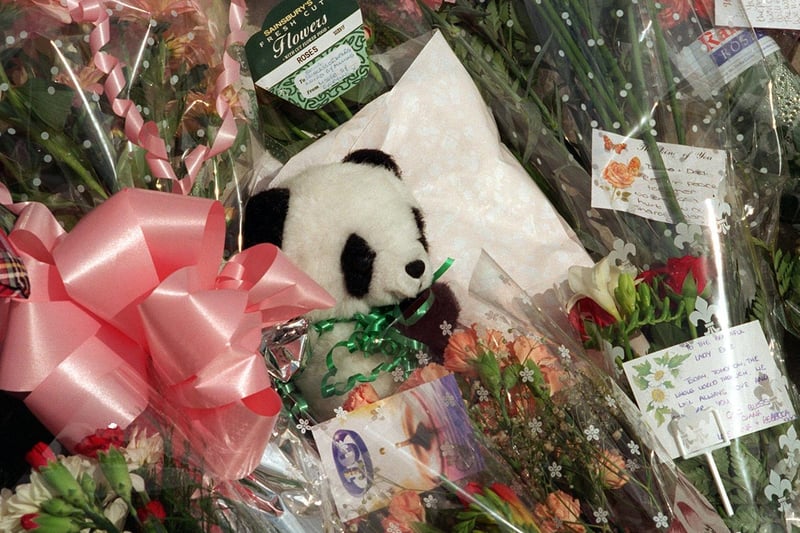 A toy panda among flowers left on Leeds Civic Hall in the memory of Diana, Princess of Wales.