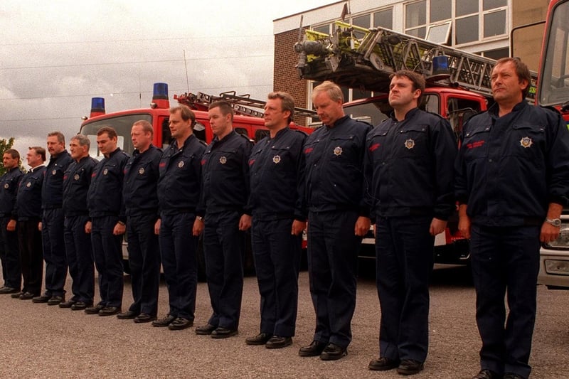 Fire fighters of 'White Watch' observe a minutes silence at Bramley Fire Station.