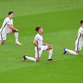 England players, including Kalvin Phillips, take the knee ahead of kick-off at Wembley. Pic: Neil Hall - Pool/Getty Images