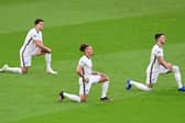 England players, including Kalvin Phillips, take the knee ahead of kick-off at Wembley. Pic: Neil Hall - Pool/Getty Images