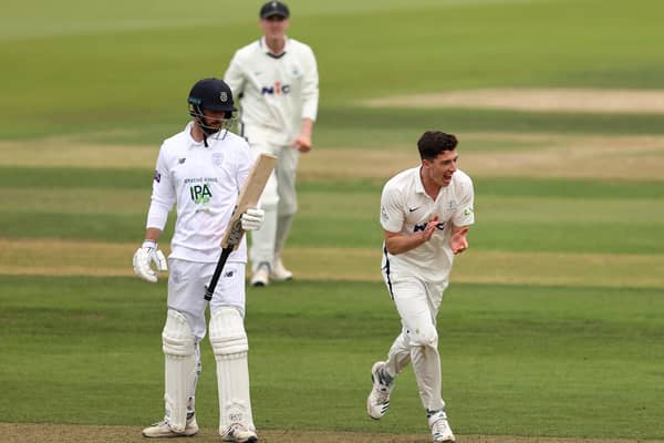GOT HIM: Yorkshire's Matt Fisher, right, celebrates after taking the wicket of Hampshire's James Vince, left, on day two at The Ageas Bowl Picture: Ryan Pierse/Getty Images