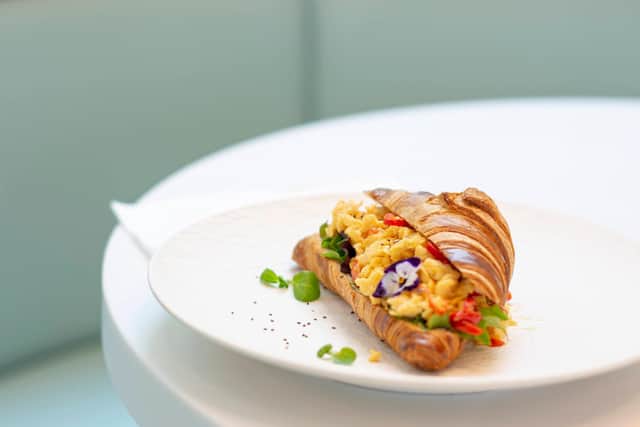 ‘A Little Eggciting’ crossaint filled with scrambled eggs and roasted peppers, combined with red onions and fresh chillies blended with cheddar cheese