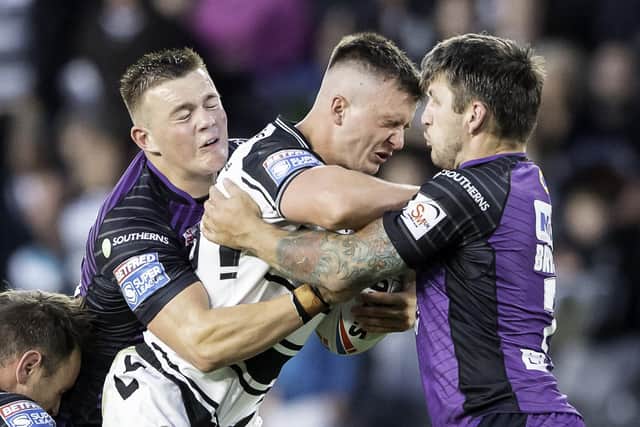 Tom Briscoe and Callum McLelland stop the run of Hull FC's Connor Wynne during the last meeting between the sides in July. Picture: Allan McKenzie/SWpix.com.