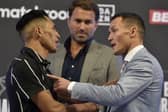 Josh Warrington makes his point to Mauricio Lara ahead of Saturday's re-match at Emerald Headingley, watched by promoter Eddie Hearn. Picture: Steve Riding.