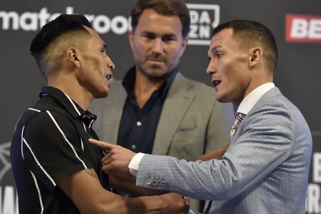 Josh Warrington makes his point to Mauricio Lara ahead of Saturday's re-match at Emerald Headingley, watched by promoter Eddie Hearn. Picture: Steve Riding.