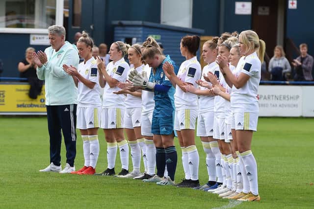 Leeds United Women applaud before the Julie Chipchase memorial game.