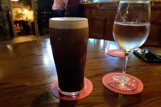 A pint of Guinness and a Pinot blush at the Village Wine Bar, Farsley.