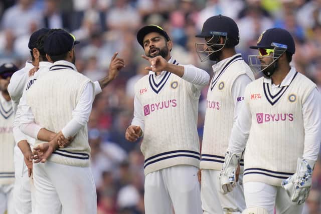 India's Virat Kohli, centre, speaks with his team on day two of the fourth Test match at The Oval Picture: AP/Kirsty Wigglesworth