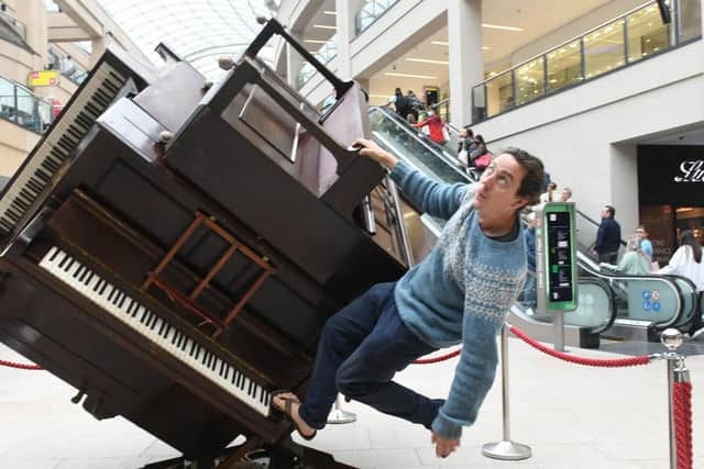 Artist Tim Vincent-Smith with his work The Piano Cube at Trinity Leeds. PIC: Gary Longbottom
