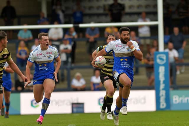 Rhyse Martin, right, will remain at Rhinos in 2022. Picture by Jonathan Gawthorpe.