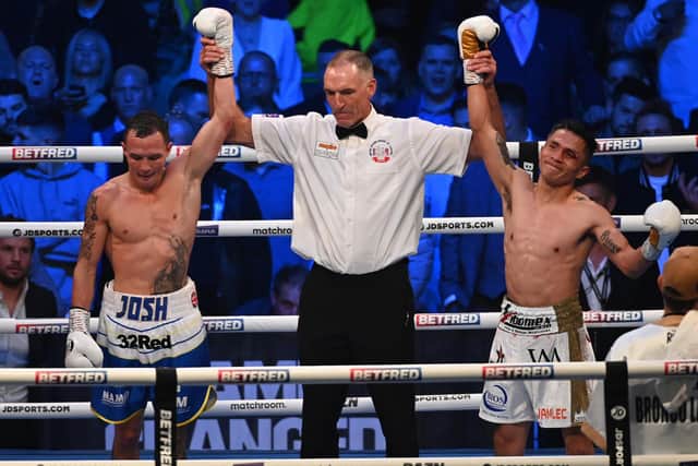 DRAW: Josh Warrington and Mauricio Lara have their arms raised. Picture: Matthew Pover/Matchroom Boxing