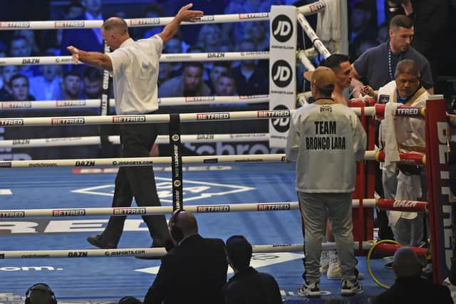 The referee stops Josh Warrington's fight with Mauricio Lara as the Mexican's corner try to stem the flow of blood from a head wound caused by an accidental clash of heads. Picture: Steve Riding.