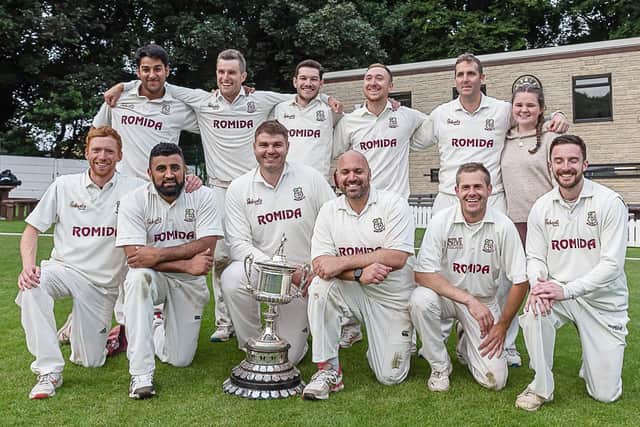 The Woodlands team show off the Bradford League Premier Division trophy after the clinching the title with victory over New Farnley. Picture: Ray Spencer.