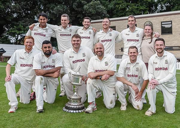 The Woodlands team show off the Bradford League Premier Division trophy after the clinching the title with victory over New Farnley. Picture: Ray Spencer.