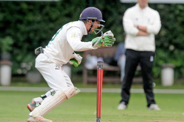 New Farnley wicketkeeper Dan Hodgson stumps Woodlands' Cieran Garner off the bowling of Daniel Houghton. Picture: Steve Riding.