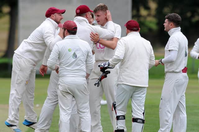Sam Hyde of Horsforth Hall Park celebrates after bowling New Rover's Fahid Rehman for 0 in the Aire-Wharfe League on Saturday. Picture: Steve Riding.