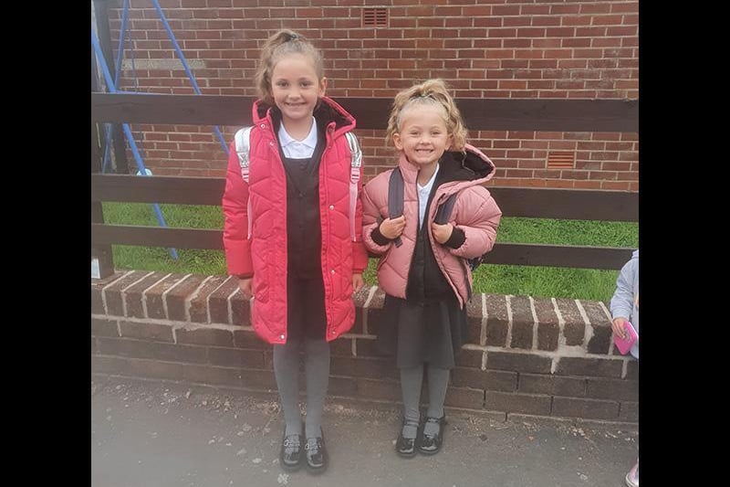 Lily-Mae, aged 4, first day in reception and Mia, aged 7, first day in juniors. Picture by Beckiieeyy Dilworth.