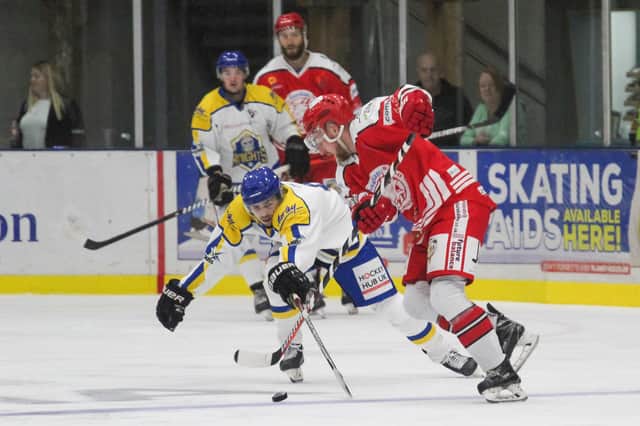 CHARGING ON TOGETHER: Leeds Knights' Ethan Hehir battles for puck possession against Swindon Wildcats last Sunday night. Picture courtesy of Kat Metcalfe/Swindon Wildcats.