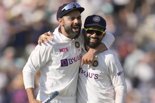 India's Virat Kohli, left, and India's KL Rahul smile as they leave the pitch after beating England by 157 runs on day five at The Oval Picture: AP/Kirsty Wigglesworth.