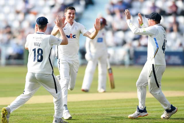 Yorkshire's Matt Fisher celebrates the wicket of Somerset's Azhar Ali with teammates George Hill and Dom Bess. Pictures: Will Palmer/SWpix.com