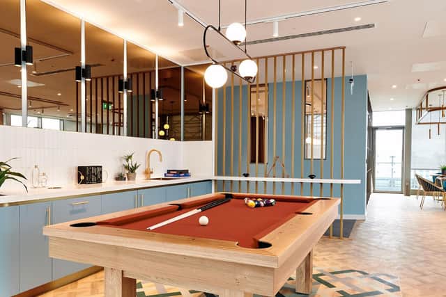 On the ground floor, there are work spaces, a gym, a wellness studio and a meeting room/office.