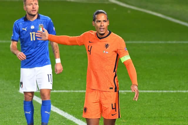 Van Dijk marshalling the back line in a Nations League match against Italy.