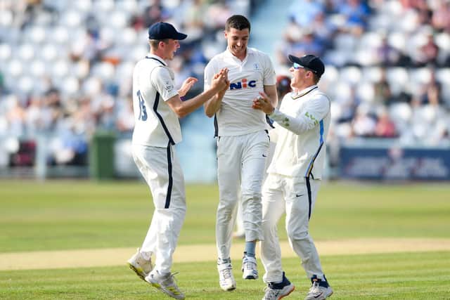 CAREER-BEST: Yorkshire's Matt Fisher celebrates the wicket of Somersets Azhar Ali with team-mates George Hill and Dom Bess Picture by Will Palmer/SWpix.com