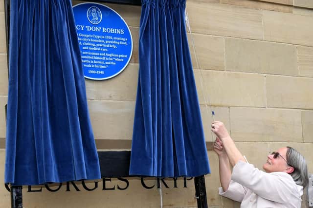 Delia Robins unveils a blue plaque to her father-in-law Percy 'Don' Robins at St George's Crypt. PIC: Gary Longbottom