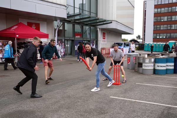 Fans play cricket outside of the Emirates Old Trafford in Manchester after India forfeited the fifth Test against England over Covid concerns, the England and Wales Cricket Board has announced. Picture: Martin Rickett/PA