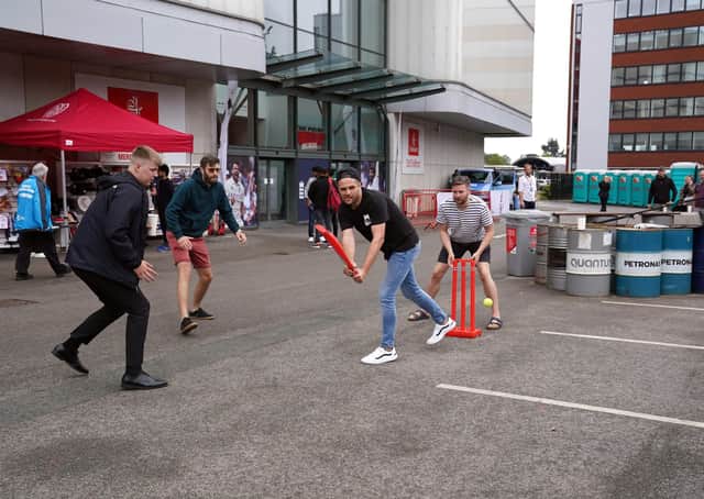 Fans play cricket outside of the Emirates Old Trafford in Manchester after India forfeited the fifth Test against England over Covid concerns, the England and Wales Cricket Board has announced. Picture: Martin Rickett/PA