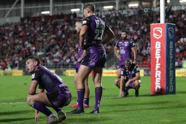 Hard to take: Leeds Rhinos' Brad Dwyer and his team-mates react after another Saints try. Picture: Richard Sellers/PA Wire.
