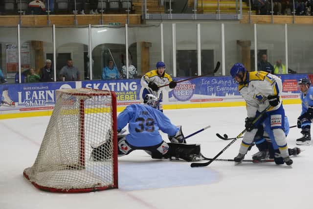 Close call: Leeds Knights's Kieran Brown (far side) gets a shot in on Miles Finney. Picture: Andy Bourke/Podium Prints