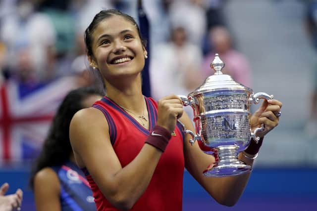Emma Raducanu holds up the US Open championship trophy after defeating Leylah Fernandez  in New York AP/Seth Wenig