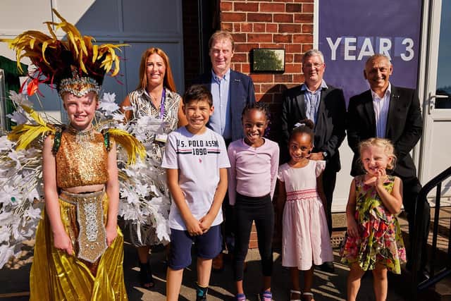 The plaque at Alder Tree school is unveiled at the newly rebranded school's official launch.