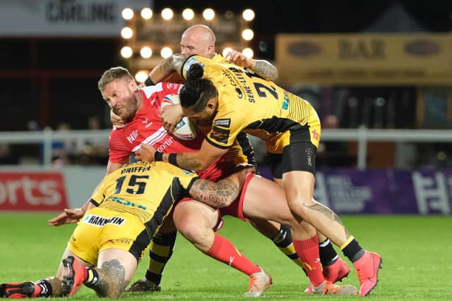 Hull KR's Will Maher is brought down by the Castleford defence. (DEAN ATKINS/SWPIX)